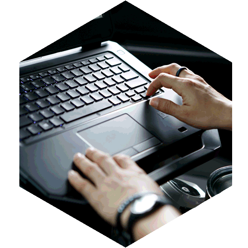 Hands Typing on a Laptop